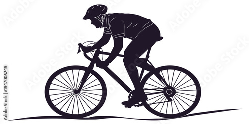A silhouette of a cyclist riding a bicycle on a road with a
