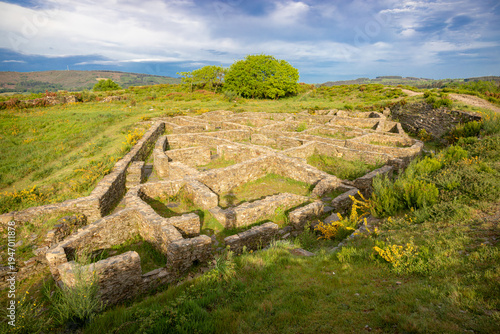 Ancient stone ruins of the Iron Age Castro de Castromaior hillfort. Archaeological site on the Camino de Santiago French Way in Lugo, Galicia, Spain.