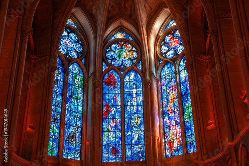 Beautiful stained glass windows in the altar of the famous catholic Reims Cathedral, UNESCO world heritage site, in Reims, France
