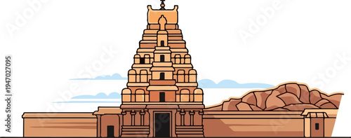 Ornate terracotta temple tower with layered architecture against a pale sky and rocky hills