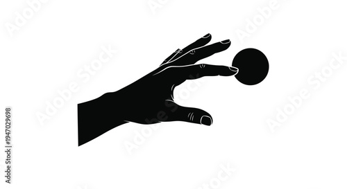 A hand reaching for a sphere dramatically presented as a silhouette