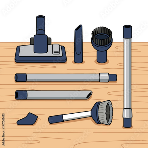 Set of vacuum cleaner attachments and extension tubes arranged on wooden floor for home cleaning