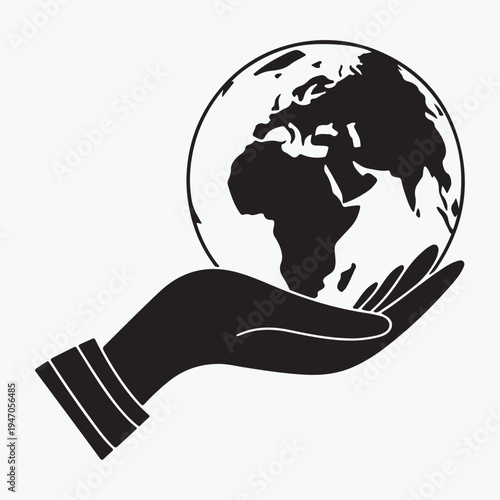 A hand carefully holding a blue glass globe represents a global business concept and the environmental protection of our green planet earth