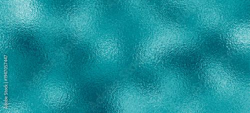 Shimmering ocean blue metallic foil texture with abstract frozen glass effect for winter and technology design backgrounds