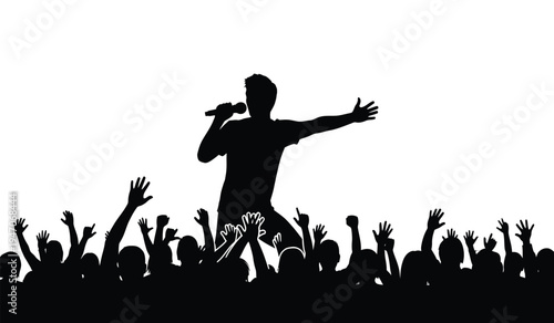 A silhouette of a male singer performing with a microphone in front of an excited cheering crowd