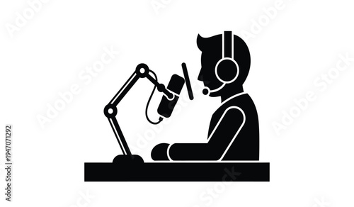 A male podcast host wearing a headset while speaking into a professional microphone on a desk arm