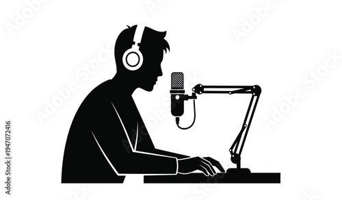 Black silhouette of a person wearing headphones while speaking into a professional desk microphone