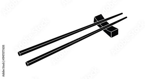 Black chopsticks and a rest displayed on a plain white background