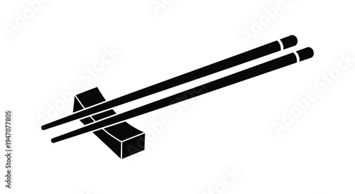 Black chopsticks resting on a small geometric stand against a white background