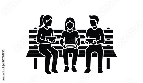 Three young people sitting together on a park bench while holding and looking at their devices