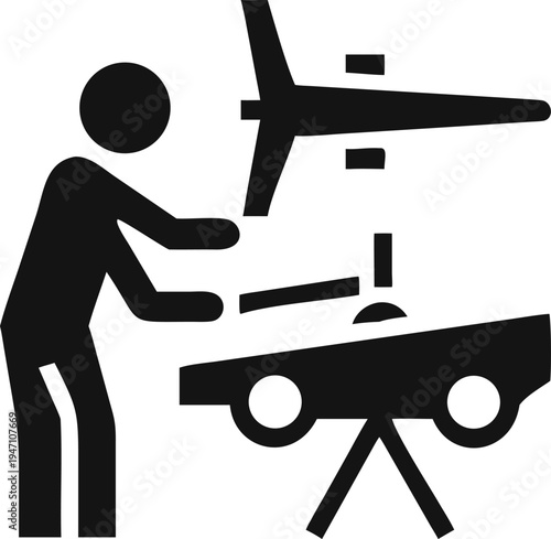 Skilled technician meticulously assembles a large aircraft fuselage onto its robust wheeled support frame