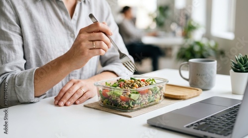 Fresh Salad and Laptop: A Healthy Work Lunch Break in Modern Office