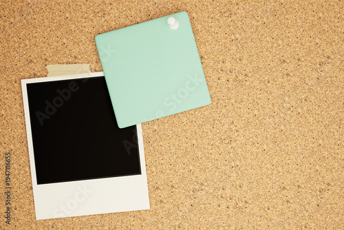 Blank Polaroid Frame and Mint Green Note Card Pinned on Cork Board
