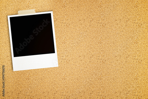 Blank Polaroid Photo Frame Taped on Cork Board Background