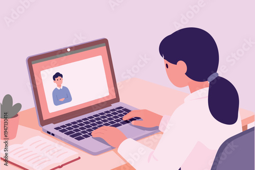 Woman participating in a virtual meeting on her laptop with a colleague