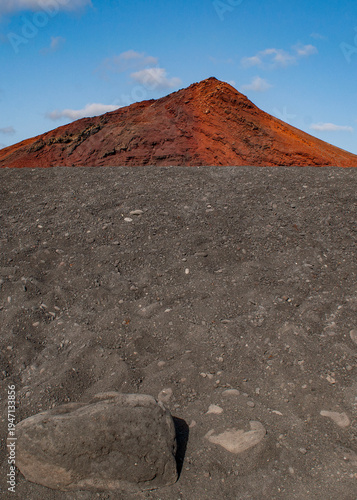 Lanzarote, Canary Islands: breathtaking desert landscape and red mountain in Timanfaya National Park (Parque Nacional de Timanfaya), famous geological park entirely made up of volcanic soi