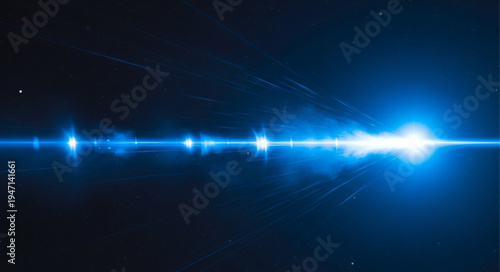 Bright Blue Lens Flare Effect on Dark Background.