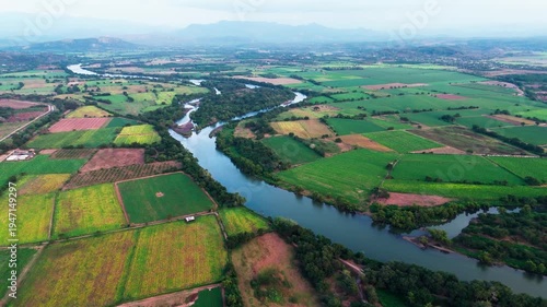 Aerial view of santiago river crossing agricultural plantations, nayarit mexico