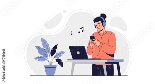 Man listening to music on headphones while using phone and laptop at desk