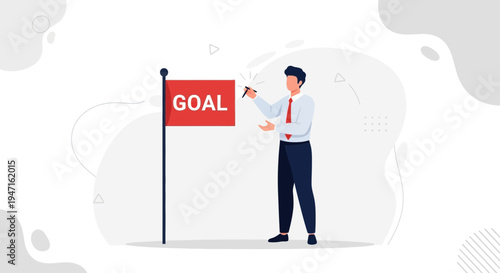 Businessman writing 'GOAL' on a red flag, concept of achieving success and business objectives