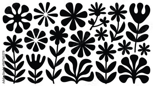 Assorted black and white floral and leaf cutouts for decorative or crafting use
