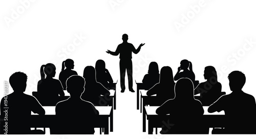 A lecturer presents to a classroom full of students silhouette
