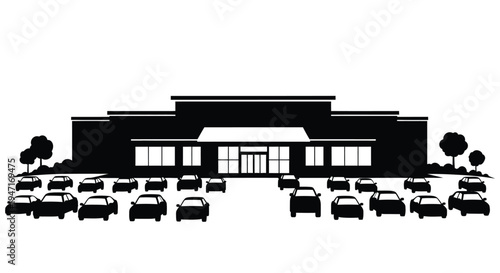 Black silhouette of a building and parking lot with multiple cars silhouette