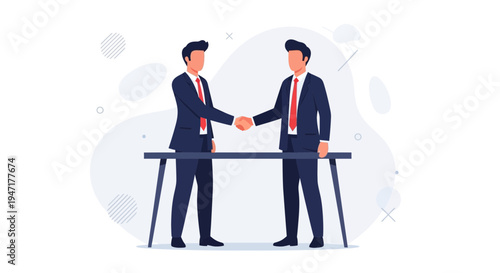 Businessmen shaking hands over a table, symbolizing agreement and partnership