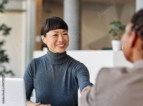 Photos Group of young business people having a meeting shaking hands handshake introducing each other or making a deal agreement during meeting in the office