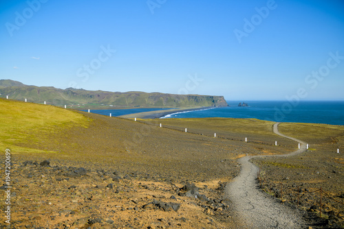 Path leading to Dyrholaey viewpoint overlooking black sand beach