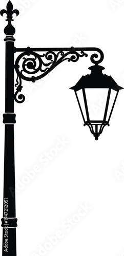 Black silhouette of vintage street lamp post with ornate bracket