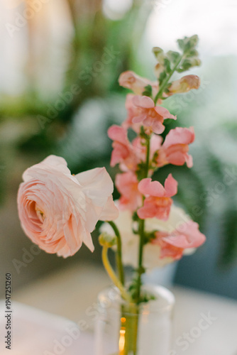 Wallpaper Mural Flowers in a glass vase on a table during the day with sunlight and greenery in the background Torontodigital.ca