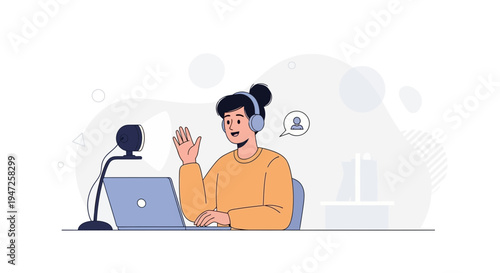 Young woman with headphones and microphone streaming online via laptop, waving hello