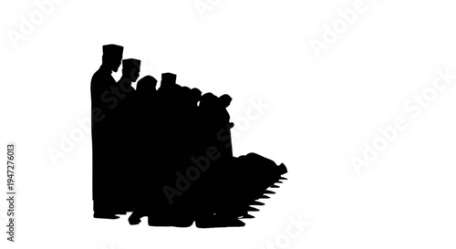 Silhouette of a group of people holding hands on a train platform