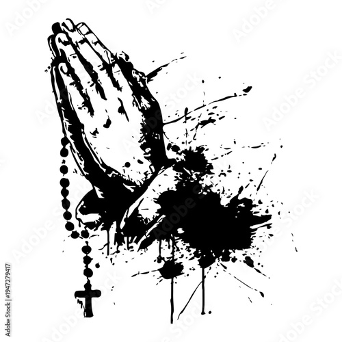 Praying hands holding a rosary with ink splatters and artistic grunge style