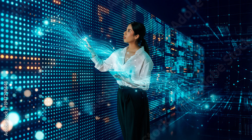 Latin woman interacting with digital data wall using tablet