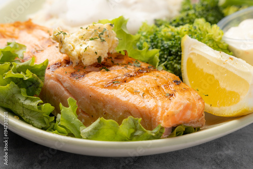 Grilled salmon dinner with lemon broccoli and mashed potatoes