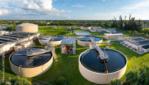 Large-scale industrial water treatment plant purifying and recycling water through filtration and chemical processes to meet health and safety standards
