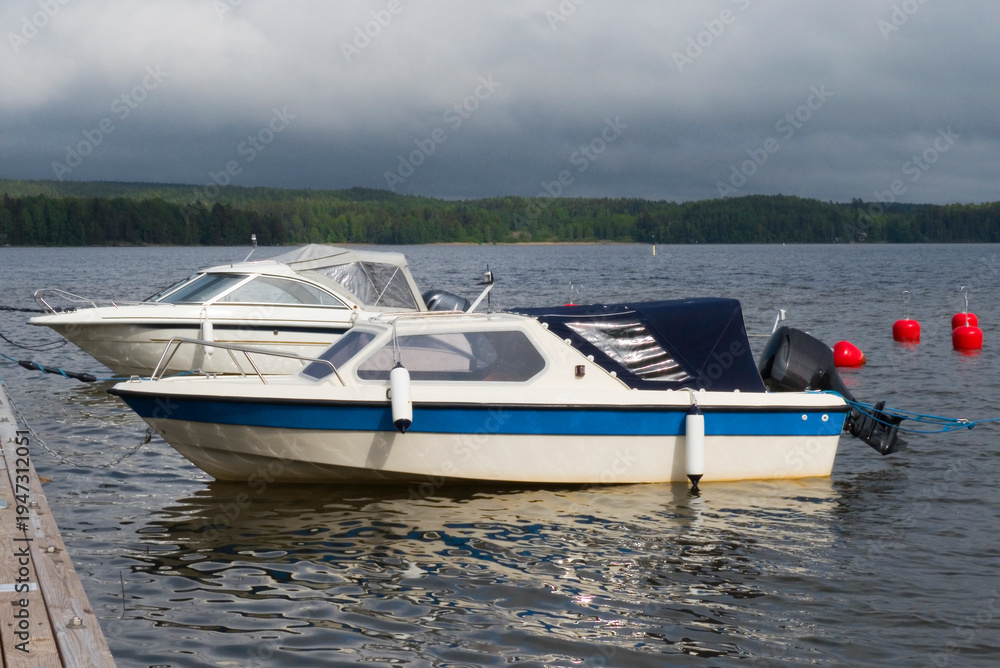 Fototapeta premium Motorboats moored on Heposelka lake in Kangasala, Finland