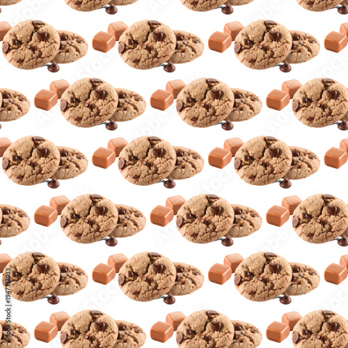 Delectable chocolate cookies scattered with caramel bits on a white background.