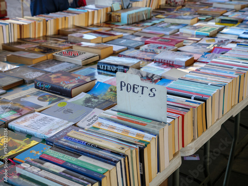 Secondhand paperback poetry books for sale on a market stall