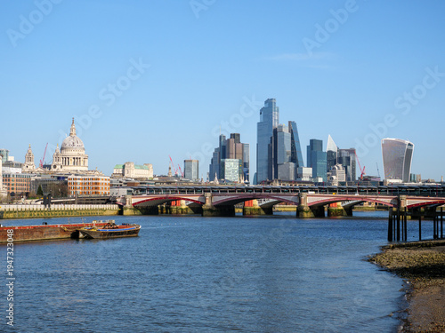 View of the river Thames and city skyline of modern skyscraper office buildings of the financial district and Blackfriars Bridge, London, UK