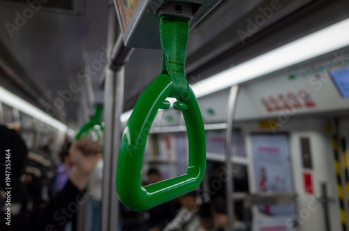 Wallpaper Mural Green hand strap in dim subway interior Torontodigital.ca