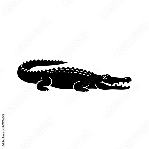 A sleek black silhouette of a crocodile resting on a flat surface