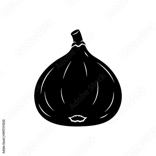 Black garlic bulb with a single clove visible in the center