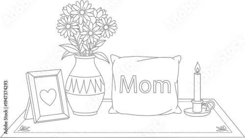 Black and white outline drawing depicts a memorial arrangement featuring a vase of daisies, a framed photo, a pillow labeled Mom, and a lit candle.
