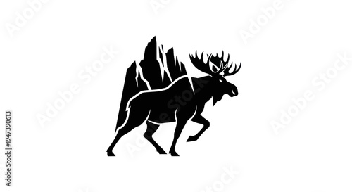 Moose silhouette beside mountain peak