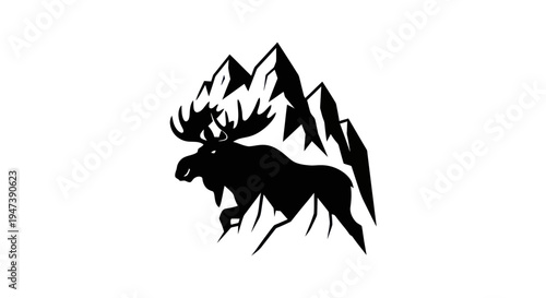 Moose silhouette climbing mountain peaks