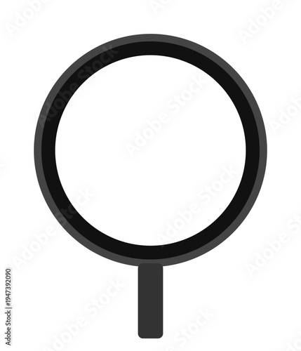 A magnifying glass sits on a surface for inspection purposes.