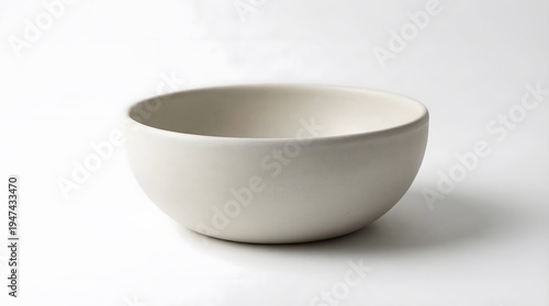 Ceramic bowl centered on white studio background with soft shadow simple tableware